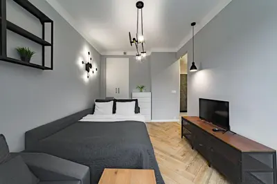 Łóżko lub łóżka w pokoju w obiekcie Apartament w Centrum Warszawy - Dworzec Centralny