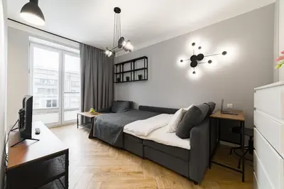 Łóżko lub łóżka w pokoju w obiekcie Apartament w Centrum Warszawy - Dworzec Centralny