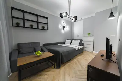 Łóżko lub łóżka w pokoju w obiekcie Apartament w Centrum Warszawy - Dworzec Centralny
