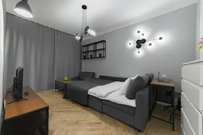 Łóżko lub łóżka w pokoju w obiekcie Apartament w Centrum Warszawy - Dworzec Centralny