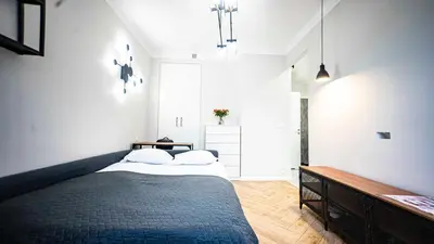 Łóżko lub łóżka w pokoju w obiekcie Apartament w Centrum Warszawy - Dworzec Centralny