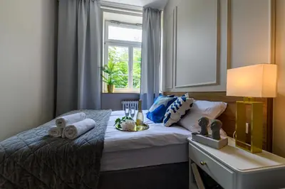 Łóżko lub łóżka w pokoju w obiekcie Movo Old Town Apartments