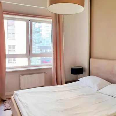 Łóżko lub łóżka w pokoju w obiekcie Chopin Apartments - Platinum Towers