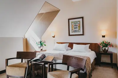 Łóżko lub łóżka w pokoju w obiekcie Mamaison Le Regina Boutique Hotel