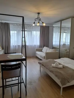 Łóżko lub łóżka w pokoju w obiekcie Apartament Ogrodowa Studio Warszawa