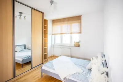 Łóżko lub łóżka w pokoju w obiekcie SuperApart Marszałkowska 83 - Blisko PKiN i Metra