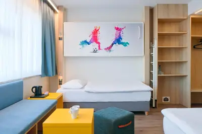 Łóżko lub łóżka w pokoju w obiekcie o3Hotel
