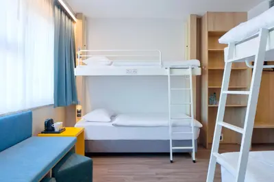 Łóżko lub łóżka w pokoju w obiekcie o3Hotel