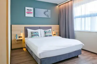 Łóżko lub łóżka w pokoju w obiekcie o3Hotel