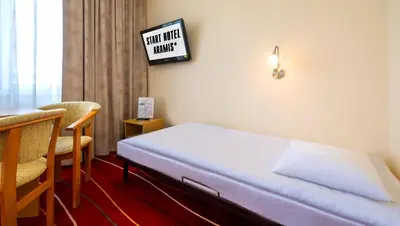 Łóżko lub łóżka w pokoju w obiekcie Aramis