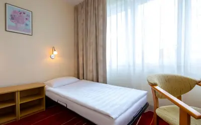 Łóżko lub łóżka w pokoju w obiekcie Aramis