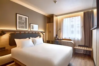 Łóżko lub łóżka w pokoju w obiekcie CAMPANILE PRIME Warszawa Centrum