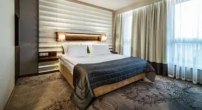 Łóżko lub łóżka w pokoju w obiekcie Airport Hotel Okęcie