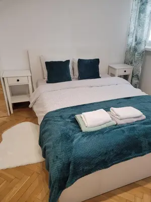 Łóżko lub łóżka w pokoju w obiekcie Apartament Centrum Sliska