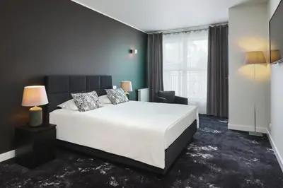 Łóżko lub łóżka w pokoju w obiekcie Mamaison Residence Diana