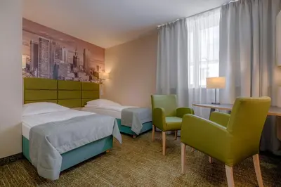 Łóżko lub łóżka w pokoju w obiekcie Hotel Reytan