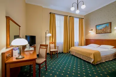 Łóżko lub łóżka w pokoju w obiekcie Hotel Hetman