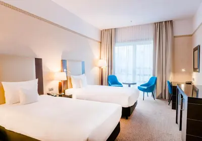 Łóżko lub łóżka w pokoju w obiekcie Hotel Polonia Palace