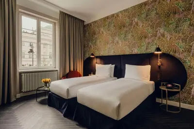 Łóżko lub łóżka w pokoju w obiekcie Flaner Hotel, WorldHotels Crafted