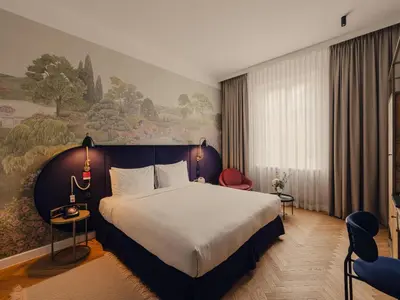 Łóżko lub łóżka w pokoju w obiekcie Flaner Hotel, WorldHotels Crafted