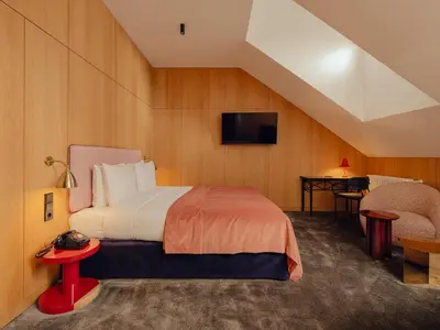 Łóżko lub łóżka w pokoju w obiekcie Flaner Hotel, WorldHotels Crafted