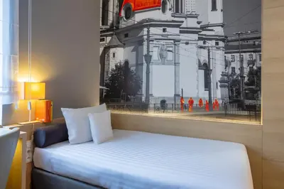 Łóżko lub łóżka w pokoju w obiekcie Hotel MDM City Centre