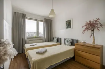 Łóżko lub łóżka w pokoju w obiekcie Gama Home Wyspowa 1