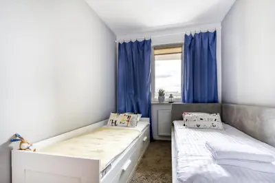 Łóżko lub łóżka w pokoju w obiekcie Gama Home Wyspowa 1