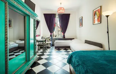 Łóżko lub łóżka w pokoju w obiekcie Old Town Kanonia Rooms & Apartments