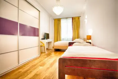 Łóżko lub łóżka w pokoju w obiekcie Old Town Kanonia Rooms & Apartments