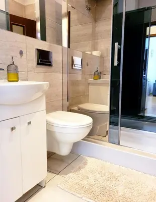 Łazienka w obiekcie Przytulne apartamenty w centrum Warszawy Lok 2