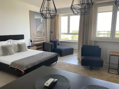 Łóżko lub łóżka w pokoju w obiekcie LuxLux Apartments Sand