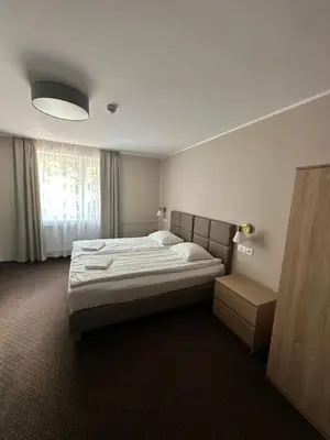Łóżko lub łóżka w pokoju w obiekcie GRACJA