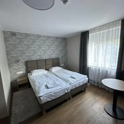 Łóżko lub łóżka w pokoju w obiekcie GRACJA
