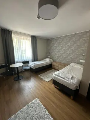 Łóżko lub łóżka w pokoju w obiekcie GRACJA