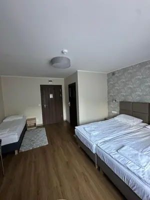 Łóżko lub łóżka w pokoju w obiekcie GRACJA