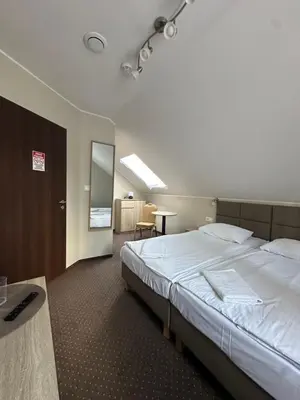 Łóżko lub łóżka w pokoju w obiekcie GRACJA