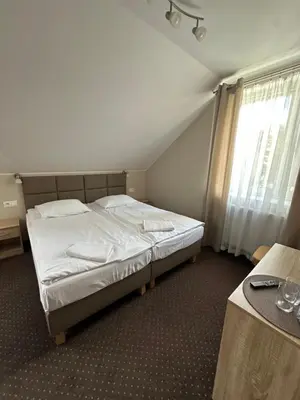 Łóżko lub łóżka w pokoju w obiekcie GRACJA