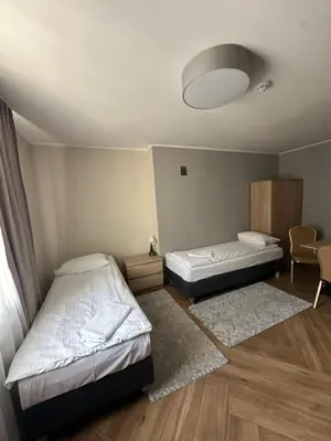 Łóżko lub łóżka w pokoju w obiekcie GRACJA