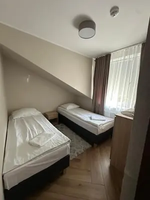 Łóżko lub łóżka w pokoju w obiekcie GRACJA