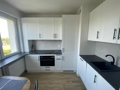 Kuchnia lub aneks kuchenny w obiekcie Brand New Top Floor Apartment at Mokotow