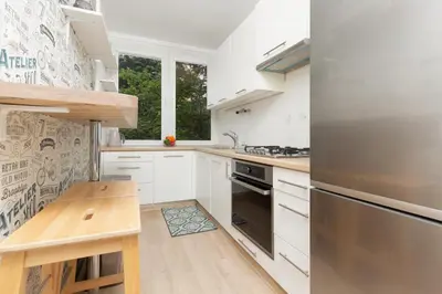 Kuchnia lub aneks kuchenny w obiekcie Warsaw Mokotów Lakeside Family Apartment by Noclegi Renters