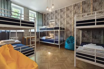 Łóżko lub łóżka w pokoju w obiekcie Tatamka Hostel