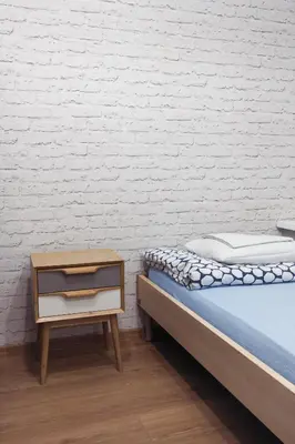 Łóżko lub łóżka w pokoju w obiekcie Tatamka Hostel