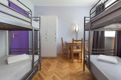 Łóżko lub łóżka w pokoju w obiekcie Tatamka Hostel