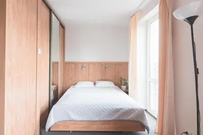 Łóżko lub łóżka w pokoju w obiekcie Warsaw Apartments Magnolie