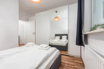 Łóżko lub łóżka w pokoju w obiekcie Żeromskiego 1(B) by Homeprime