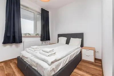 Łóżko lub łóżka w pokoju w obiekcie Żeromskiego 1(B) by Homeprime