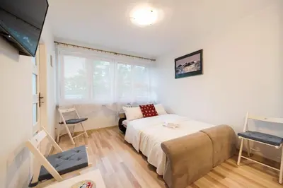 Łóżko lub łóżka w pokoju w obiekcie Solec Powiśle Apartment by BookingHost