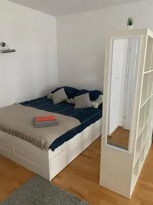 Łóżko lub łóżka w pokoju w obiekcie Apartament Francuska Pokoje Rooms